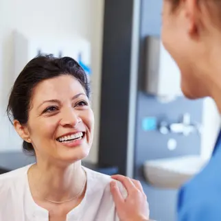 Female doctor talking with female patient